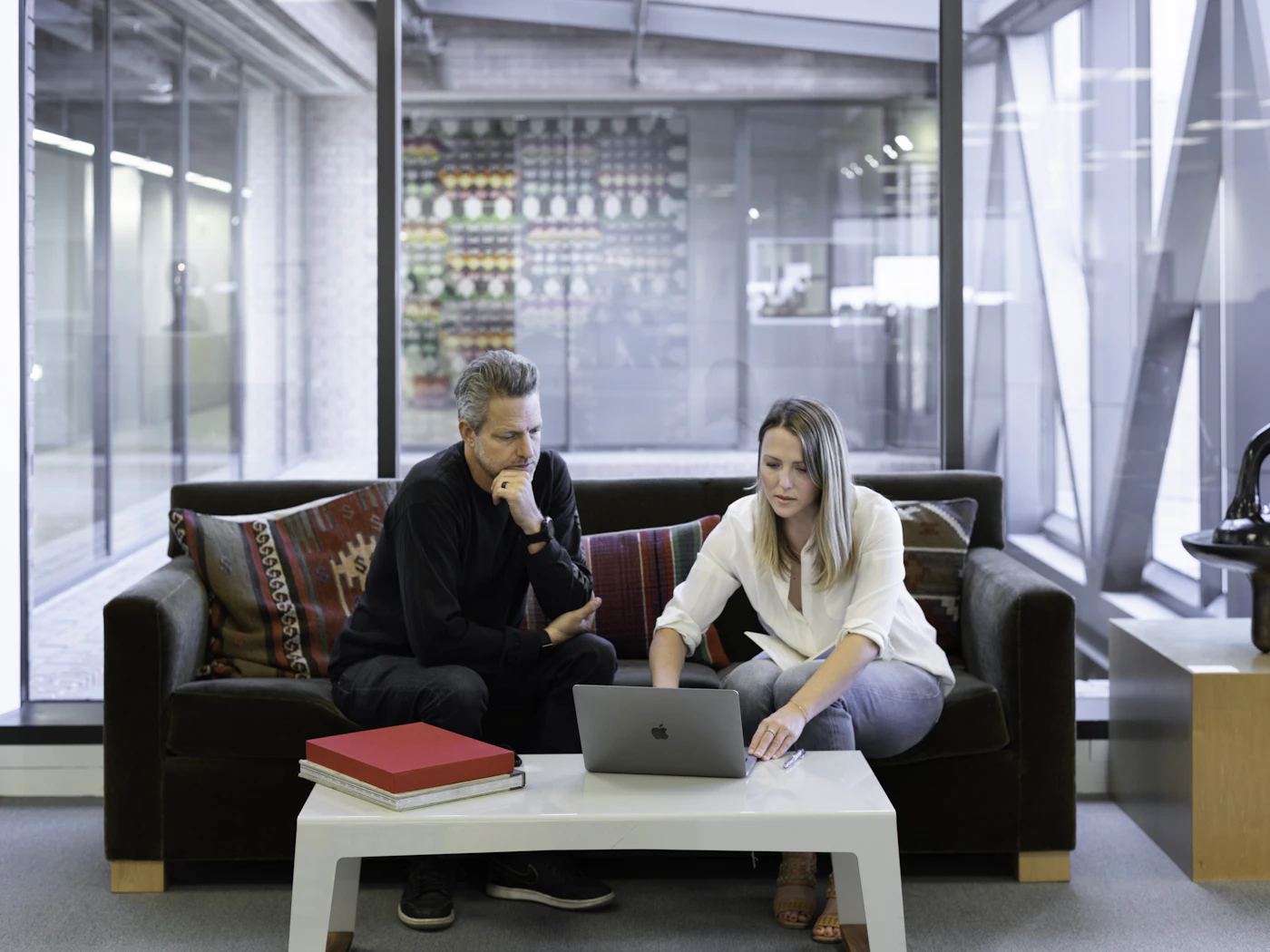 A couple on their sofa joining the consult call together